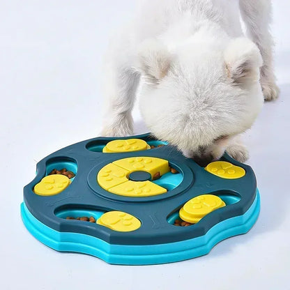 Small white dog using an interactive puzzle feeder to find treats